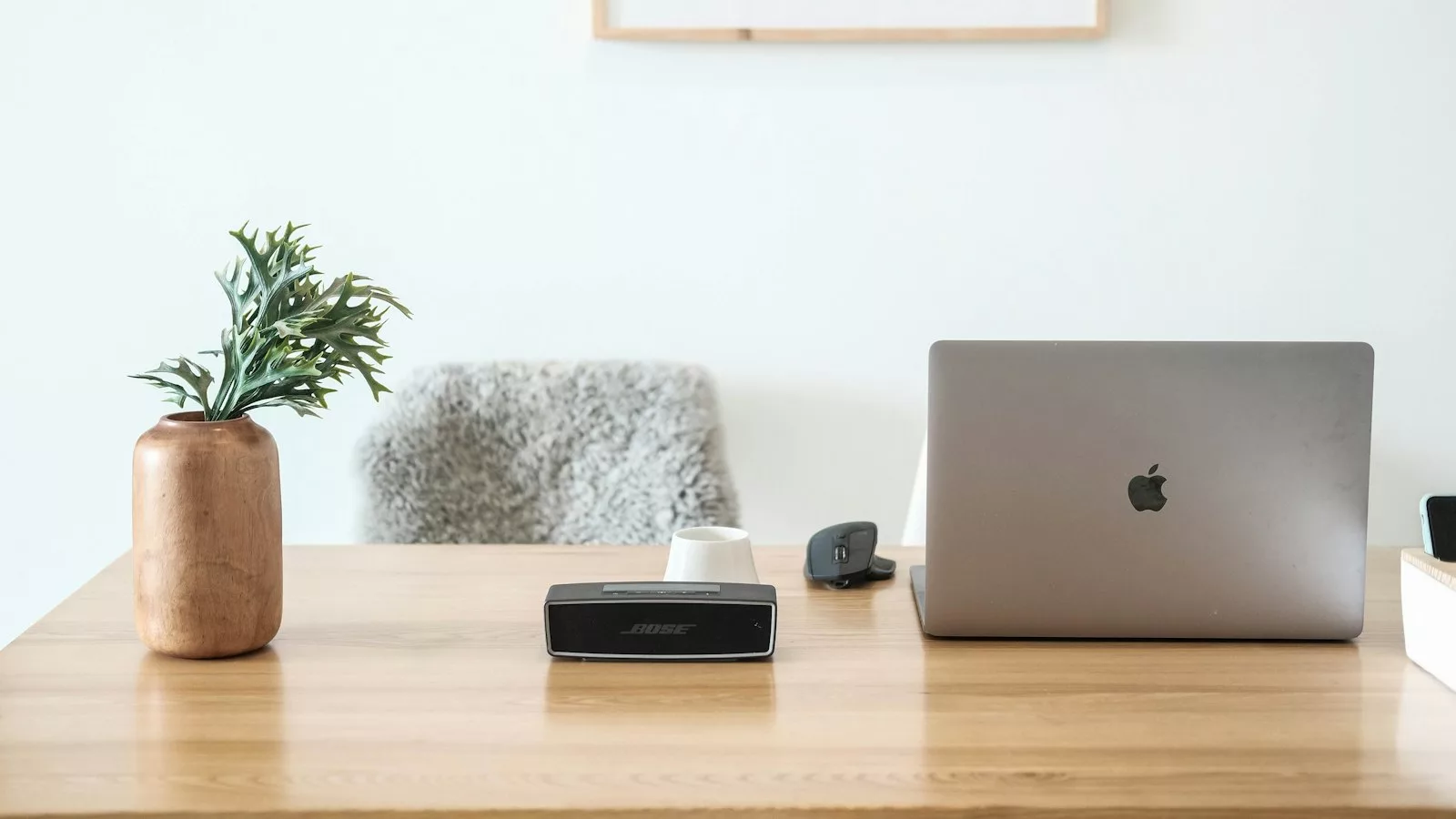 Macbook pro on brown wooden table